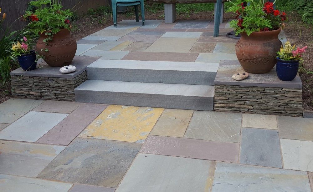 Full color bluestone patio with bluestone steps and thin colonial wall